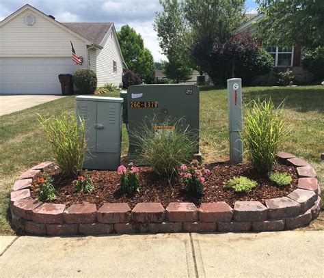 can you park in front of a green electrical box|green electrical box landscape.